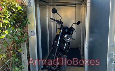 Kawasaki Z650 stored inside a bespoke 1100mm wide ArmadilloBoxes secure outdoor motorcycle storage unit