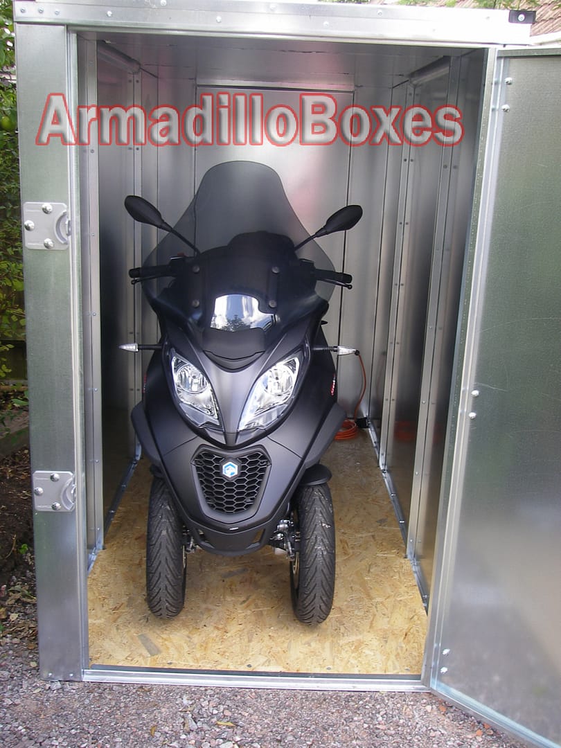 Piaggio MP3 secure outdoor motorcycle storage Piaggio MP3 three-wheel scooter stored inside an ArmadilloBoxes secure outdoor storage unit